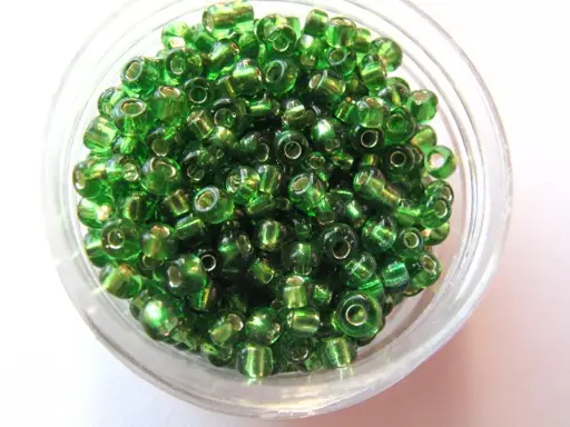 Korálky sklenené rokajl 3mmx14g/zelené hráškové priesvitné